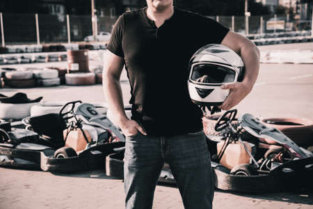 A young man drives a go kart at circuitの写真素材