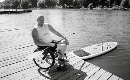 Person with a physical disability in a wheelchair will be ride on sup board