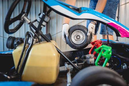 The mechanic go kart racing service change the wheels