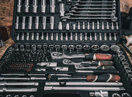A set of mechanics tools on the table at car serviceの写真素材