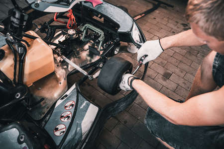 The mechanic go kart racing service change the wheelsの写真素材