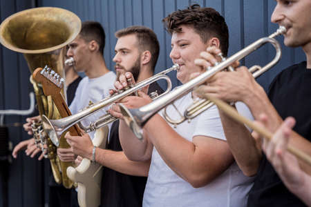 Young street music band play a lot of musical instrumentsの写真素材