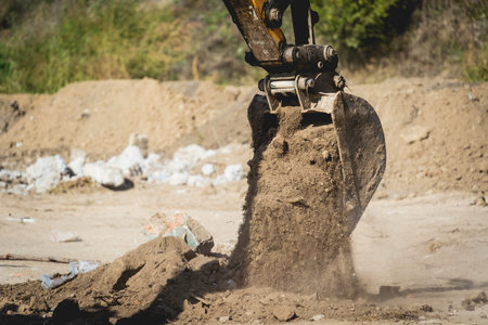 Wheel loader excavator works at construction site