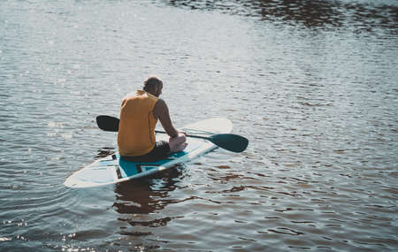 Person with a physical disability ride on sup boardの写真素材