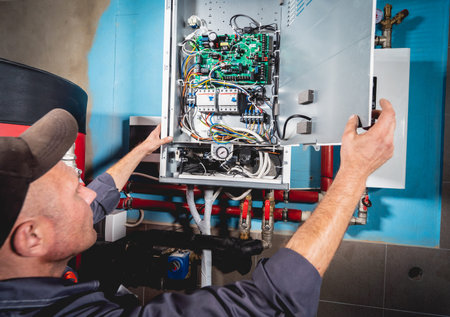Air conditioning technician is checking air conditioner