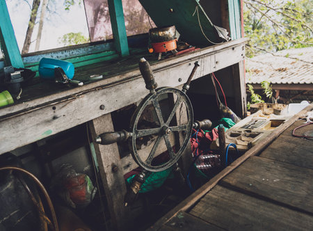 Old thai wooden boat on the beachの写真素材
