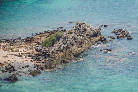 Beautiful mountains with palms landscape in the oceanの写真素材