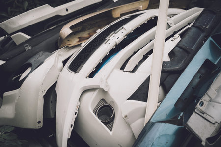 Heap of waste automotive parts in old car service