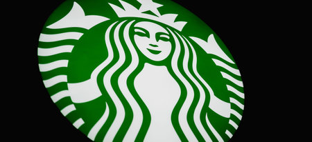 PHUKET, THAILAND - MAY 29, 2022: Starbucks Coffee Shop brand logo signboard on the storefront in the...