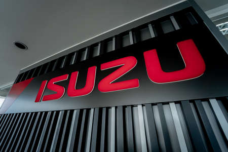 PHUKET, THAILAND - JUNE 05, 2022: Signboard with logo of Isuzu Motorsのeditorial素材