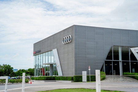 PHUKET, TAHAILAND - JUNE 05, 2022: Showroom of dealership Audi. Signboard with logo of Audi against...