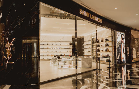 PHUKET, THAILAND - MAY 29, 2022: Yves Saint Laurent brand retail shop logo signboard on the...