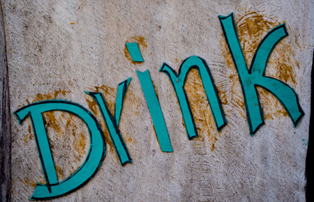 Wooden sign board with drink in tropical cafeの写真素材