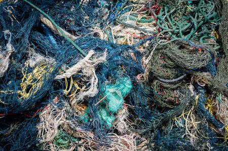 Detail view and background of used fishing netsの写真素材