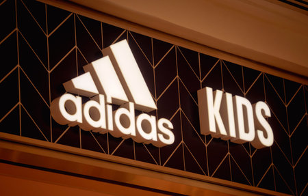 KUALA LUMPUR, MALAYSIA - DECEMBER 04, 2022: Adidas brand retail shop logo signboard