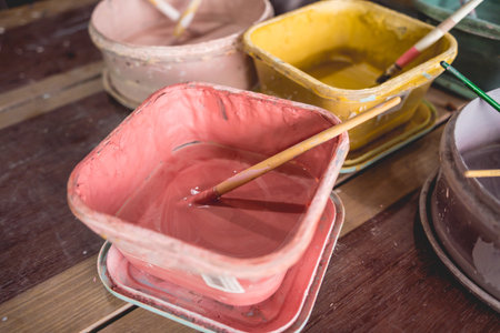 Jars with acrylic paints at a workshopの写真素材