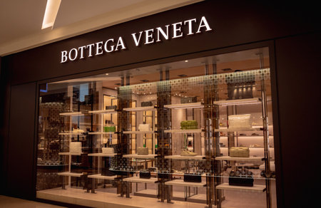 KUALA LUMPUR, MALAYSIA - DECEMBER 04, 2022: Bottega Veneta brand retail shop logo signboardのeditorial素材