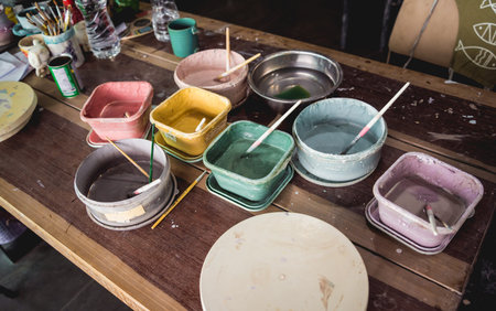 Jars with acrylic paints at a workshop