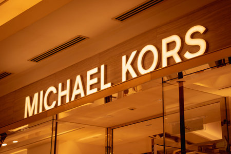 KUALA LUMPUR, MALAYSIA - DECEMBER 04, 2022: Michael Kors brand retail shop logo signboard on the...