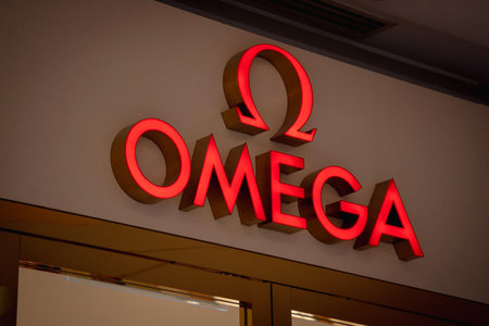 KUALA LUMPUR, MALAYSIA - DECEMBER 04, 2022: Omega brand retail shop logo signboardのeditorial素材