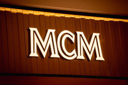 KUALA LUMPUR, MALAYSIA - DECEMBER 04, 2022: MCM brand retail shop logo signboard on the storefront in the shopping mallのeditorial素材