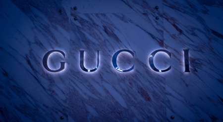 KUALA LUMPUR, MALAYSIA - DECEMBER 04, 2022: Gucci brand retail shop logo signboard on the storefront...