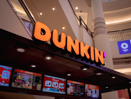 KUALA LUMPUR, MALAYSIA - DECEMBER 04, 2022: Dunkin donut brand retail shop logo signboard on the storefront in the shopping mallのeditorial素材