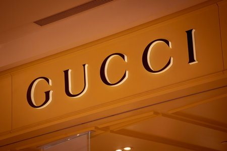 KUALA LUMPUR, MALAYSIA - DECEMBER 04, 2022: Gucci brand retail shop logo signboard on the storefront in the shopping mallのeditorial素材