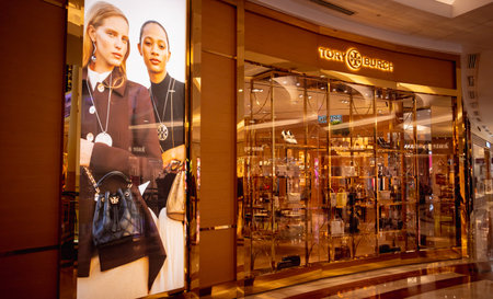 KUALA LUMPUR, MALAYSIA - DECEMBER 04, 2022: Tory Burch brand retail shop logo signboard on the...