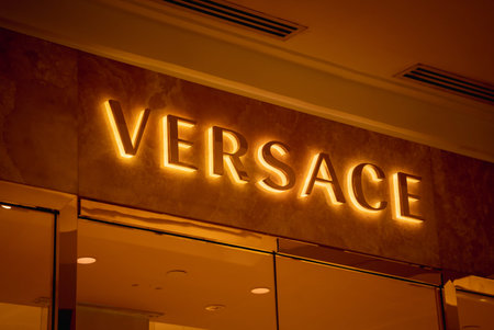 KUALA LUMPUR, MALAYSIA - DECEMBER 04, 2022: Versace brand retail shop logo signboard on the...