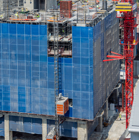 Big elevator on the exterior of a new building constructionの写真素材