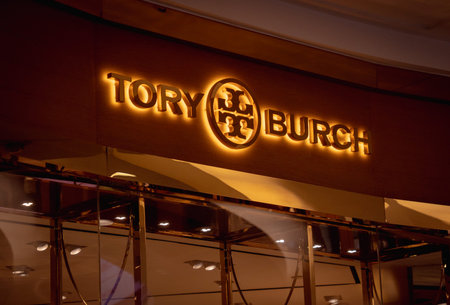 KUALA LUMPUR, MALAYSIA - DECEMBER 04, 2022: Tory Burch brand retail shop logo signboard on the...