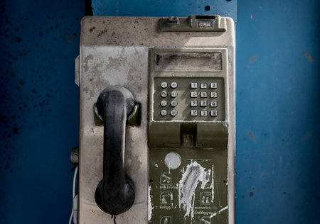 Old and dirty street phones at the city landfill