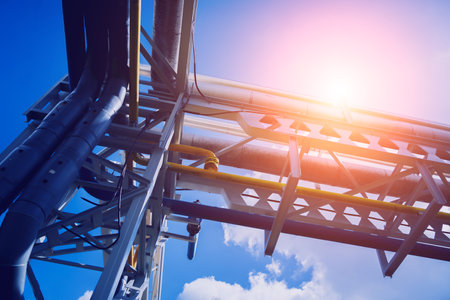 Modern steam pipeline for industrial on blue skies background.の写真素材