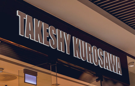 WARSAW. POLAND - MAY 21, 2023: Takeshy Kurosawa brand retail shop logo signboard on the storefront in the shopping mallのeditorial素材