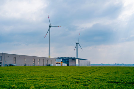Windmill farm at the fields with beautiful blue sky
