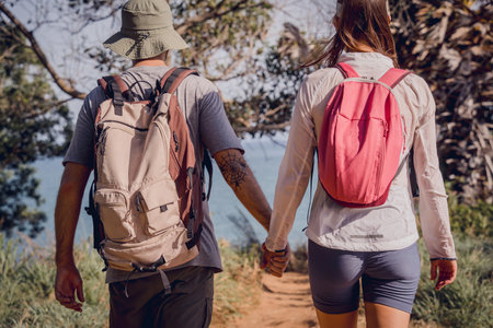 Happy young couple traveling in the jungle forest near the oceanの写真素材