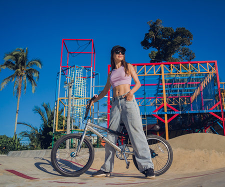 Happy young woman enjoy BMX riding at the skateparkの写真素材