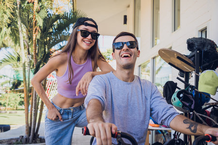Young happy couple enjoy BMX riding at the skateparkの写真素材