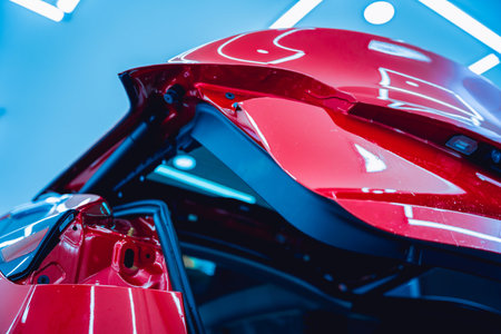 The process of installing protective film on the new red car.の写真素材