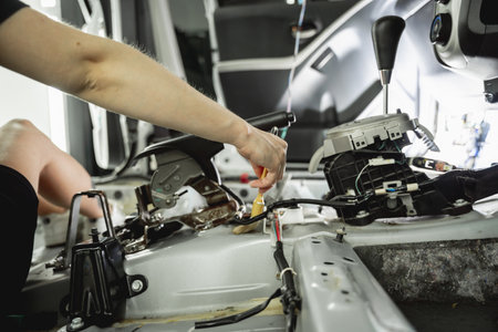 Worker make dry cleaning the car interior using a special brush with foamの写真素材