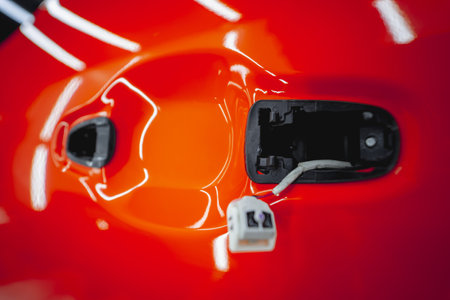 The process of installing protective film on the new red car.の写真素材