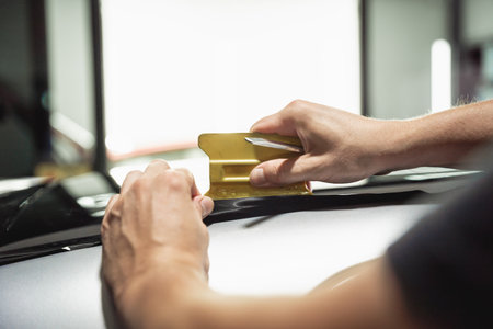 The process of installing protective film on the new car.の写真素材