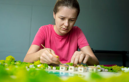 The process of making the art decor of epoxy resin, natural stones and moss