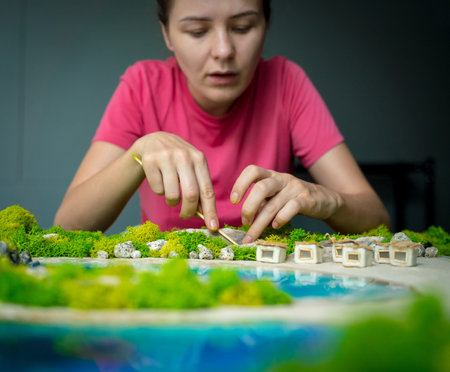 The process of making the art decor of epoxy resin, natural stones and moss