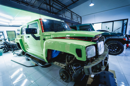 Replacing spare parts on a disassembled car in a car service garage