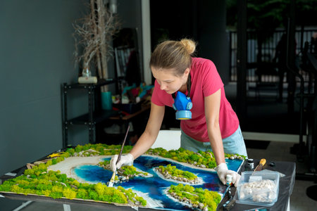 The process of making the art decor of epoxy resin, natural stones and moss
