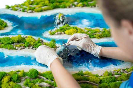The process of making the art decor of epoxy resin, natural stones and moss