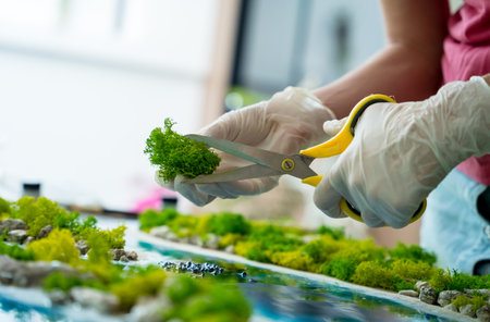 The process of making the art decor of epoxy resin, natural stones and mossの写真素材