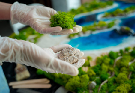The process of making the art decor of epoxy resin, natural stones and moss